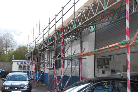Rear view of commercial scaffolding with optimised access for a working garage